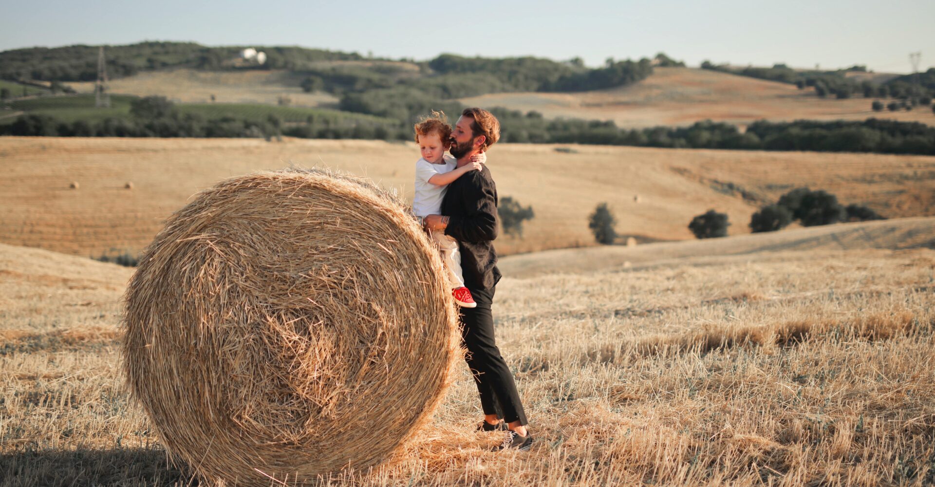 Father and son playing on field