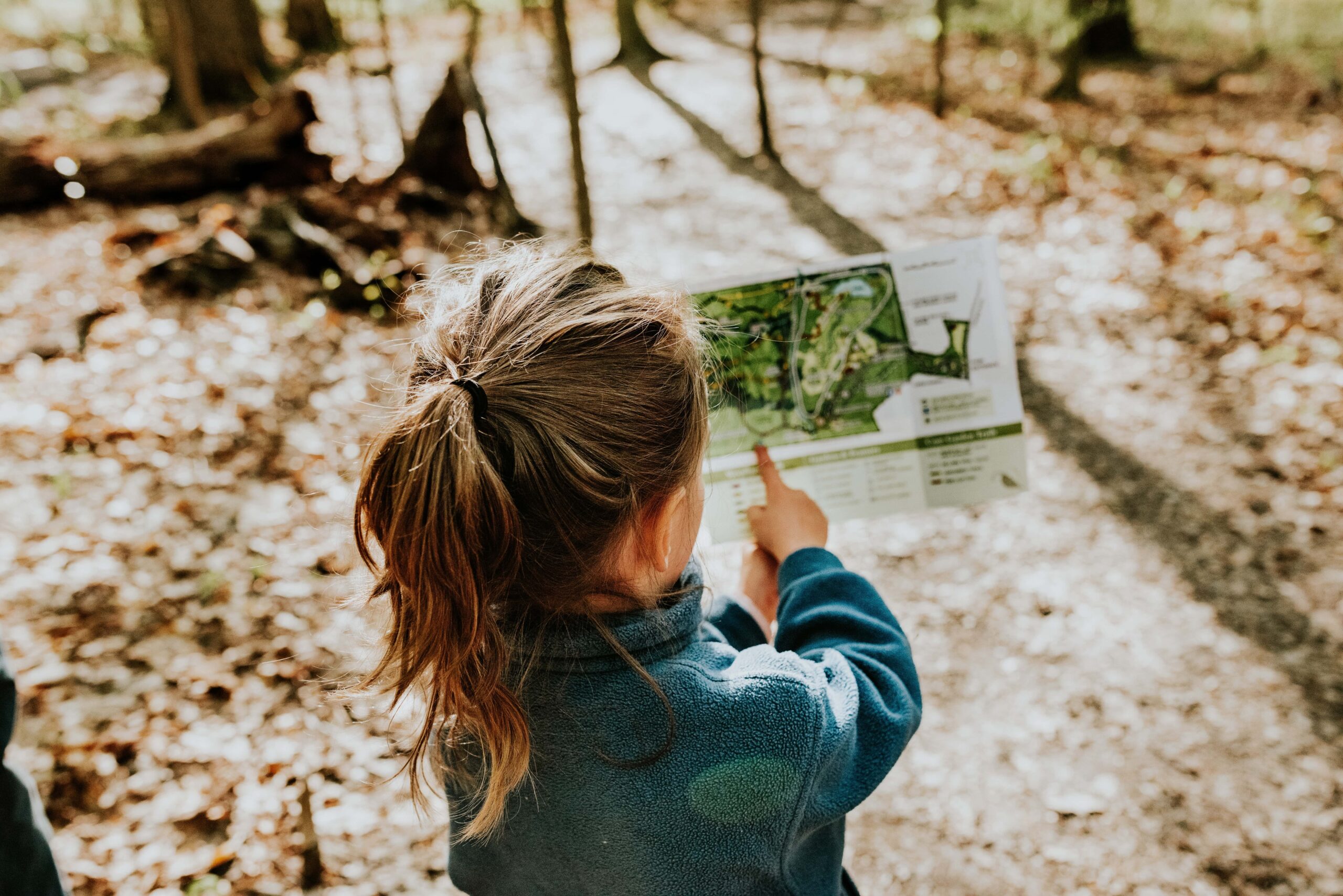 Little girl looking at map